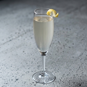 An image of the M-80 cocktail submitted by Toby that contains Old Tom Gin, Amaro Montenegro, Lemon, Simple Syrup, Prosecco and Lemon