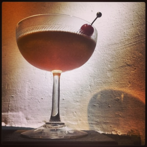 An image of the Made Man cocktail submitted by Toby that contains Rye Whiskey, Cherry Heering, Yellow Chartreuse, Fernet Branca and Cocktail Cherry