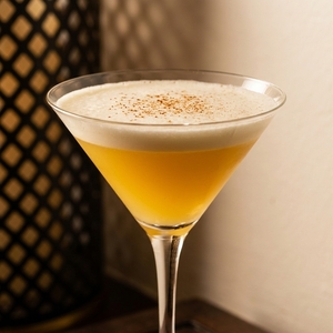 An image of the Mady cocktail submitted by Toby that contains London Dry Gin, Crème de Cacao Blanc and Lemon