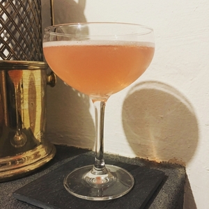 An image of the Mainland cocktail submitted by Toby that contains Grapefruit, London Dry Gin, Galliano L'authentico, Simple Syrup and Angostura Bitters