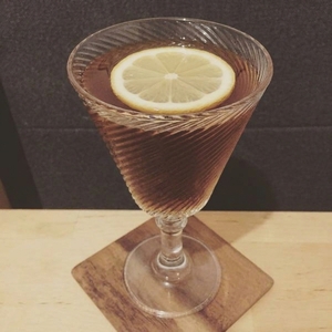 An image of the Martinez Cocktail cocktail submitted by Toby that contains Sweet Vermouth, Old Tom Gin, Maraschino Liqueur, Bitters and Lemon