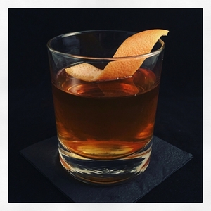 An image of the Mercado cocktail submitted by Toby that contains Mezcal, Pedro Ximénez Sherry, Amaro Montenegro, Xocolatl Mole Bitters and Grapefruit