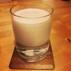 An image of the Milk Punch cocktail submitted by Toby that contains Brandy, Dark Rum, Simple Syrup, Vanilla Extract and Milk