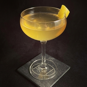 An image of the New Jersey Squirrel cocktail submitted by Toby that contains Applejack, Crème de Noyau, Lemon and Lemon