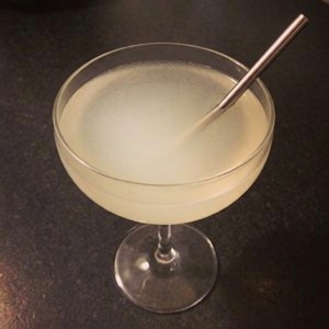 An image of the Norman Invasion cocktail submitted by Toby that contains American Gin, Apple Schnapps, Grapefruit, Simple Syrup, Orange Bitters and Sparkling Cider
