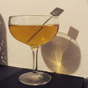 An image of the Nude Eel cocktail submitted by Toby that contains London Dry Gin, Cognac, Dubonnet Rouge and Green Chartreuse