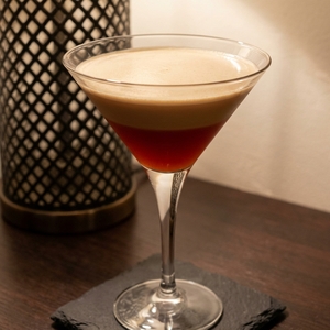 An image of the Old Flame cocktail submitted by Toby that contains London Dry Gin, Lemon, Simple Syrup, Egg and Green Chartreuse