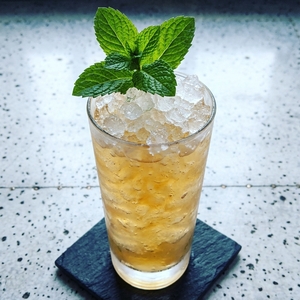 An image of the Peach Brandy Julep cocktail submitted by Toby that contains Cognac, Crème de Pêche, Peach and Mint