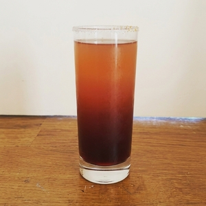 An image of the Pomegranite Storm cocktail submitted by Toby that contains Ginger Beer, Pomegranate Molasses, Clementines and Rum