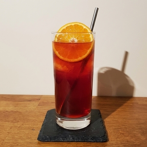 An image of the Pomegranite Storm cocktail submitted by Toby that contains Ginger Beer, Pomegranate Molasses, Clementines, Rum and Clementines