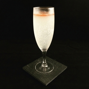 An image of the Reaulais cocktail submitted by Toby that contains Pineau des Charentes, Cognac, Pineapple Juice, Grenadine and Sparkling Wine