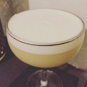 An image of the Roasty Toasty cocktail submitted by Toby that contains Pisco, Lime, Sugar, Roasted Walnut Oil, Egg and Xocolatl Mole Bitters