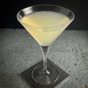 An image of the Roulette Cocktail cocktail submitted by Toby that contains Calvados, Swedish Flaggpunsch and White Rum