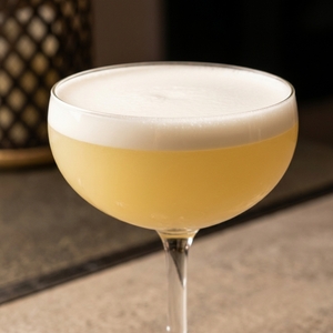 An image of the Royal Hawaiian cocktail submitted by Toby that contains London Dry Gin, Lemon, Pineapple Juice and Orgeat Syrup