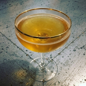 An image of the Rum Frisco cocktail submitted by Toby that contains Gold Rum, Benedictine DOM, Lemon and Bob's Bitters Abbott's Bitter