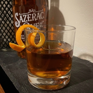 An image of the Rye Witch cocktail submitted by Toby that contains Rye Whiskey, Strega, Palo Cortado Sherry, Demerara Sugar, Orange Bitters and Orange