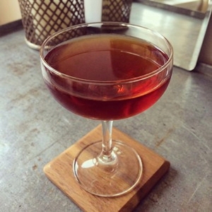 An image of the Shattered Glasser cocktail submitted by Toby that contains Reposado Tequila, Mezcal, Sweet Vermouth, Arrack, Allspice Dram, Benedictine DOM and Xocolatl Mole Bitters
