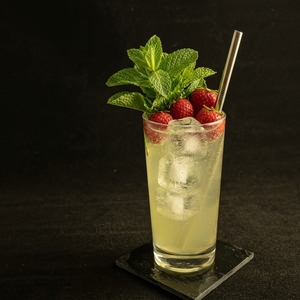An image of the Strawberry Sake Cocktail cocktail submitted by Toby that contains Strawberries, Lime, Simple Syrup, Mint, Sake and Soda Water