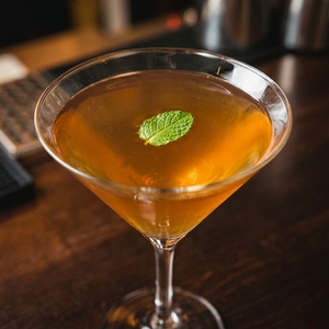 An image of the Talbott Leaf cocktail submitted by Toby that contains Bourbon, Lemon, Green Chartreuse, Cynar, Strawberry Preserve and Mint