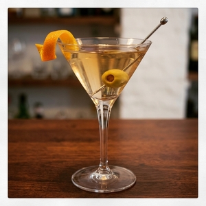 An image of the Tamboo cocktail submitted by Toby that contains London Dry Gin, Dry Vermouth, Fino Sherry, Celery Bitters, Olive and Orange