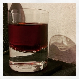 An image of the The Charlatan cocktail submitted by Toby that contains Punt e Mes, Turin Bitters, Cherry Brandy, Orange Bitters and Orange