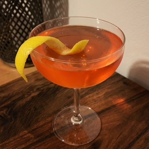 An image of the The Modernista cocktail submitted by Toby that contains Blended Scotch, Dark Rum, Absinthe, Swedish Flaggpunsch, Lemon, Orange Bitters and Lemon