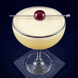An image of the The Secret Cocktail cocktail submitted by Toby that contains London Dry Gin, Applejack, Lemon, Egg, Grenadine and Cocktail Cherry
