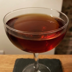 An image of the Torontino cocktail submitted by Toby that contains Bourbon, Rye Whiskey, Fernet Branca, Turin Bitters, Dubonnet Rouge and Lemon