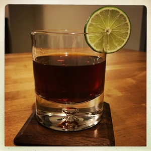 An image of the Virgin's Prayer cocktail submitted by Toby that contains White Rum, Dark Rum, Coffee Liqueur, Lemon, Orange and Lime