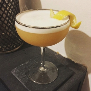 An image of the Volstead Act cocktail submitted by Toby that contains Rye Whiskey, Green Chartreuse, Quinquina, Lemon, Orange Bitters and Lemon