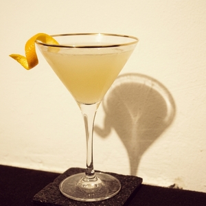 An image of the Water Lily cocktail submitted by Toby that contains London Dry Gin, Crème de Violette, Curaçao Triple Sec, Lemon and Orange