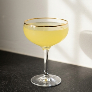 An image of the Welcome Stranger cocktail submitted by Toby that contains London Dry Gin, Swedish Flaggpunsch, Brandy, Grenadine, Lemon and Orange