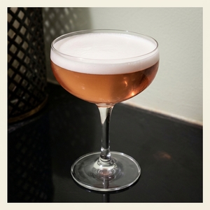 An image of the Welcome Stranger cocktail submitted by Toby that contains London Dry Gin, Swedish Flaggpunsch, Brandy, Grenadine, Lemon and Orange