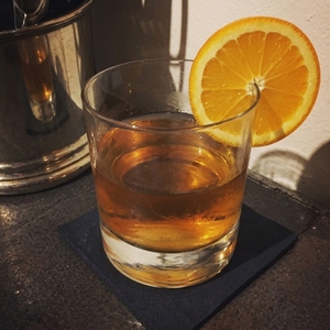 An image of the White Gin Fizz cocktail submitted by Toby that contains London Dry Gin, Lemon, Simple Syrup, Lemon Sorbet, Soda Water and Orange