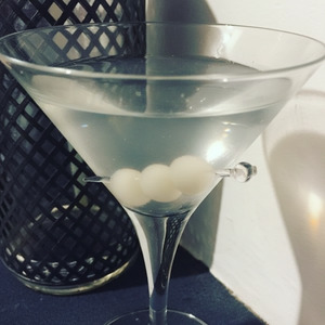 An image of the Yellow Rattler cocktail submitted by Toby that contains London Dry Gin, Sweet Vermouth, Dry Vermouth, Orange and Cocktail Onion