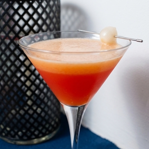 An image of the Yellow Rattler cocktail submitted by Toby that contains London Dry Gin, Sweet Vermouth, Dry Vermouth, Orange and Cocktail Onion